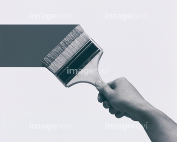 Hand holding paint brush, Stock image