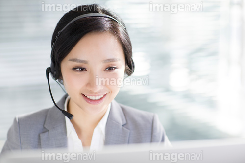 Businesswoman working in office with headset