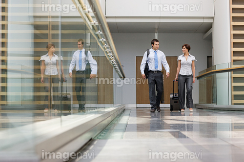 Businessman and businesswoman with suitcase